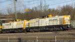 BR 203 161-5 + 293 507-0 von SGL mit Bauzug durch HH-Harburg.