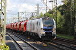 BR 159 202-1 (20-02) mit Schttgut durch HH-Harburg Richtung Norden.